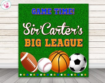 May include: A green background with the words "GAME TIME!" and "Sir Carter's BIG LEAGUE" in blue and orange. Below are illustrations of a football, baseball, basketball, and soccer ball. The sign has a star border.