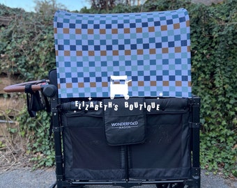 May include: A black WonderFold wagon with a checkered canopy in shades of blue, brown, and white. The wagon has black wheels and a black storage compartment. The text "ELIZABETH'S BOUTIQUE" is printed on the front.