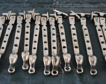Vintage bronze casement window stays,