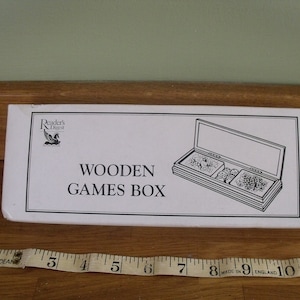 A lovely wooden games box with two packs of cards and dice 1980