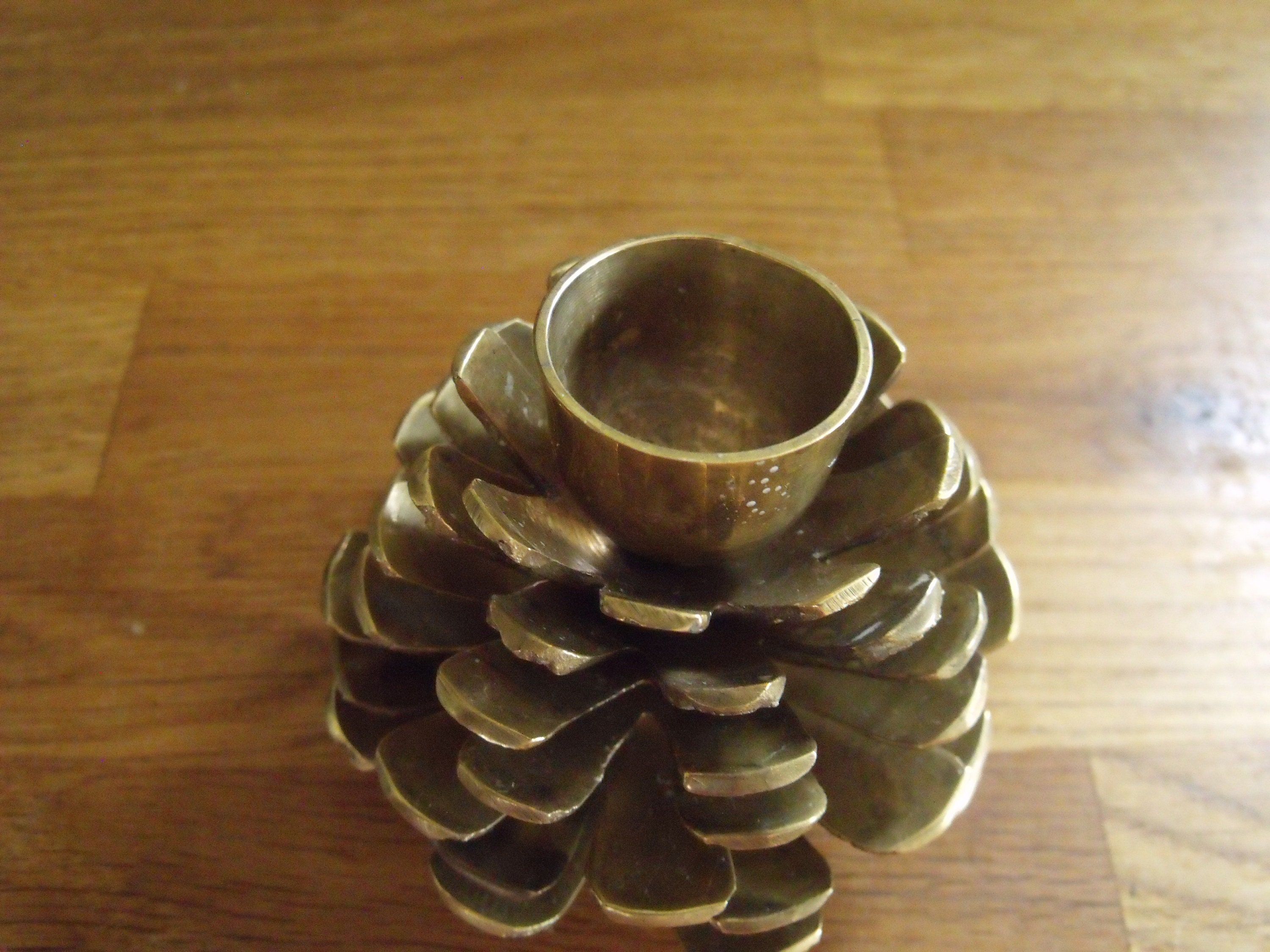 A pair of brass pinecone candle holders Etsy