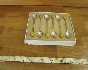 An attractive Coffee Bean Spoons by Produx of Sheffield, Bakelite Amber coloured Bean 1940s