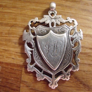 Birmingham Hallmarked silver 1894 watch medallion. Henry Potter London