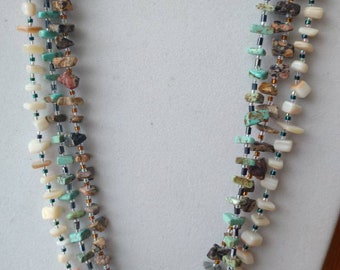 Multi strand natural rock necklace.