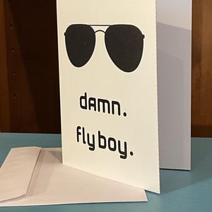 May include: A handmade wooden sign with the text "Welcome" in a playful font. The sign is painted white with a distressed finish, and features a small, decorative floral accent. It is designed for indoor or outdoor use.