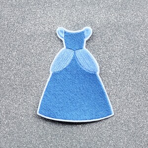 May include: A blue embroidered iron-on patch of a princess ball gown.