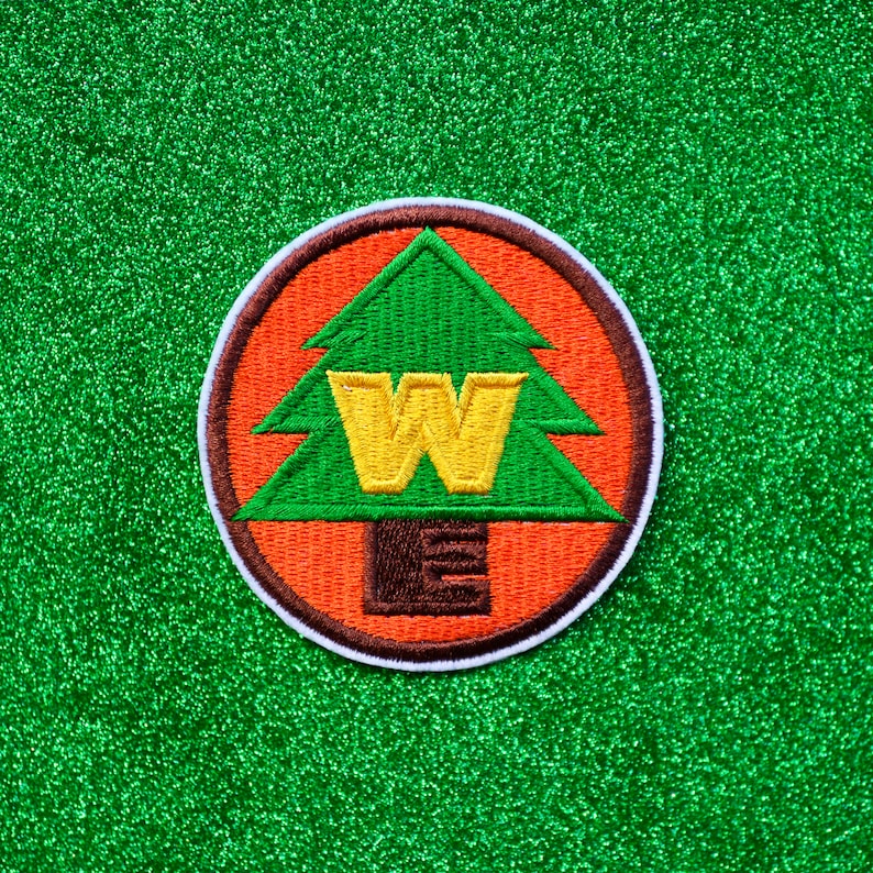WE Badge Embroidered Iron On Patch