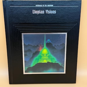 May include: A hardcover book titled "Mysteries of the Unknown: Utopian Visions." The cover is black with a silver border around a colorful illustration of a futuristic city with a glowing green structure.