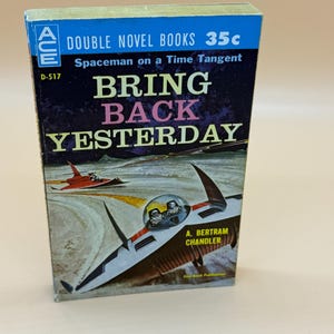 May include: A vintage paperback book titled "Bring Back Yesterday" by A. Bertram Chandler. The cover features a retro sci-fi illustration of a spaceship and a red aircraft against a blue and yellow background. The book is part of the Ace Double Novel series.