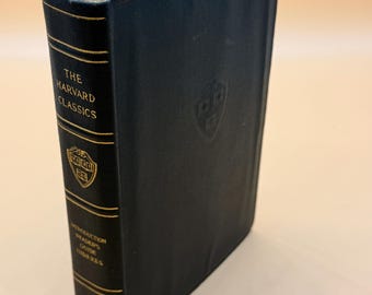 May include: A dark green hardcover book with gold lettering. The title is "The Harvard Classics" and the subtitle is "Introduction to the Reader's Guide to the Classics".