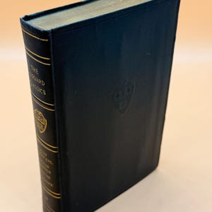 May include: A black hardcover book with gold lettering on the spine. The spine reads "The Harvard Classics".