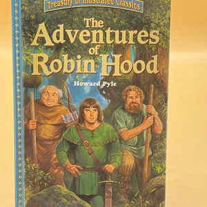 May include: A book cover featuring an illustration of Robin Hood, Little John, and Friar Tuck. The title of the book is "The Adventures of Robin Hood" by Howard Pyle. The book is part of a series called "Treasury of Illustrated Classics".