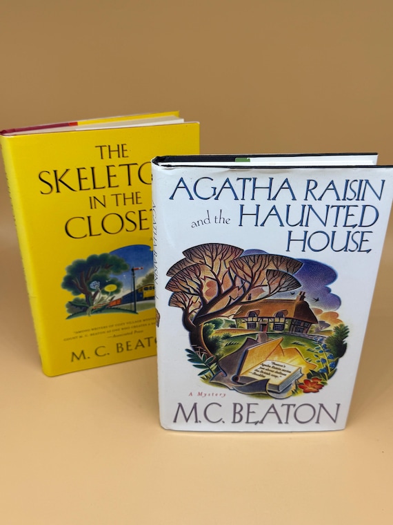2 mystery books Agatha Raisin and the Haunted House & The Skeleton in The Closet by M.C. Beaton Mystery suspense fiction novels