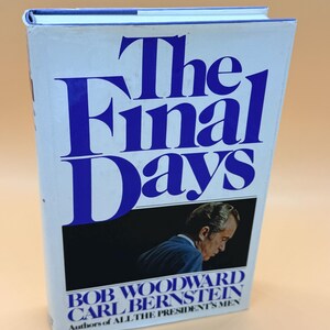 May include: A hardcover book titled "The Final Days" with large blue lettering on a white background. The cover features a black and white image of a man and the authors' names: Bob Woodward and Carl Bernstein.