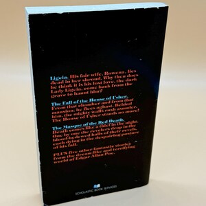 May include: A paperback book with a black cover. The text on the cover details stories by Edgar Allan Poe, including "Ligeia" and "The Fall of the House of Usher." Published by Scholastic Book Services.