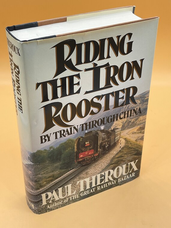 Travel Books Riding the Iron Rooster By Train Through China by Paul Theroux Used books for readers adventure books Train Travel by Rail