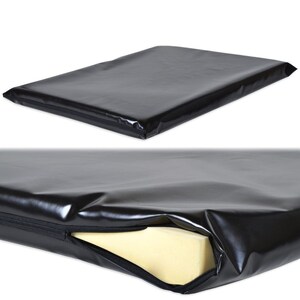 May include: A black rectangular cushion with a zip closure. The cushion is made of a shiny, waterproof material. The bottom image shows the yellow foam interior of the cushion.