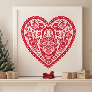 May include: Red heart-shaped design featuring a traditional Russian nesting doll, or matryoshka, at its centre. The doll is surrounded by stylised flowers and birds. The text "Alexandra" is written below the doll.