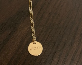 VOTE stamped gold plated necklace