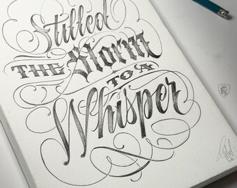 May include: A canvas with the pencil-drawn phrase "Stilled the Storm to a Whisper" in elegant calligraphy. The artwork features swirling embellishments and a pencil in the upper right corner. The canvas is white.