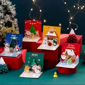 Tarjetas navideñas 3D desplegables. Paquete de 5 tarjetas navideñas con sobres en blanco. Adorables diseños de animales y Papá Noel.