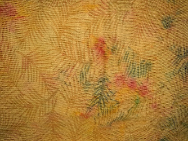 May include: A woven fabric featuring a repeating pattern of palm fronds in a muted golden yellow tone. The design is accented with soft, watercolor-style splashes of pink and green throughout the surface, creating a textured and layered appearance.