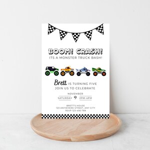 May include: White invitation card with the text "BOOM! CRASH! ITS A MONSTER TRUCK BASH!" and colorful monster truck illustrations. The invitation is for Brett's fifth birthday party, with date, time, and RSVP information.