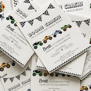 May include: White invitation cards with a monster truck theme. The cards feature colorful monster truck illustrations, checkered flag banners, and the text "Boom! Crash!" and "Brett is turning five". Includes event details.