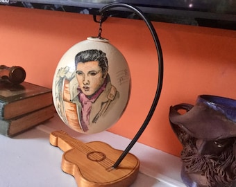 Ostrich Egg Painted Young Elvis Presley, Mounted on Guitar Stand