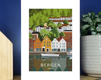May include: A colorful illustration of the city of Bergen, Norway. The image features a waterfront scene with colorful buildings, a boat, and a reflection of the buildings in the water. The text "BERGEN NORWAY" is at the bottom of the image.
