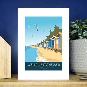 Beach Huts Wells naast de wenskaart voor het zeeportret. Meer dan 500 om uit te kiezen.