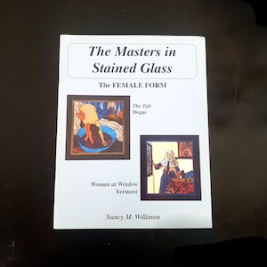 May include: A book cover with the title "The Masters in Stained Glass: The Female Form". The cover features two stained glass images, one of a woman in a bath and the other of a woman at a window. The book is by Nancy M. Willimon.