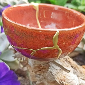 Kintsugi Red bowl broken and repaired