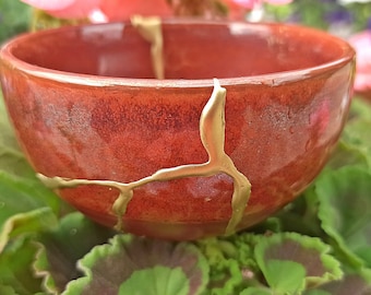 Kintsugi Red bowl broken and repaired