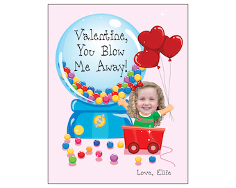 May include: A Valentine's Day card with a gumball machine and a girl's face in the center. The gumball machine has colorful gumballs and the text "Valentine, You Blow Me Away!" The girl is holding red heart balloons and the card says "Love, Ellie".