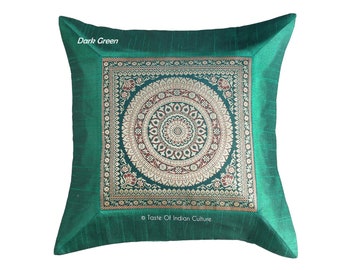 May include: A dark green square throw pillow with a gold and maroon brocade design featuring a circular mandala pattern. The pillow has a dark green border and the text "Taste Of Indian Culture" is printed on the bottom.