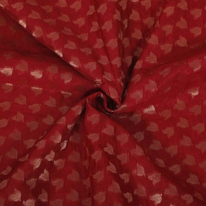 May include: Burgundy fabric with a gold leaf pattern. The fabric has a subtle sheen and a soft texture.