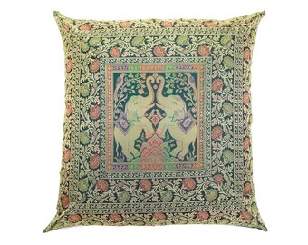 May include: Green throw pillow with a gold and ivory embroidered design of two elephants facing each other. The elephants are surrounded by floral patterns.