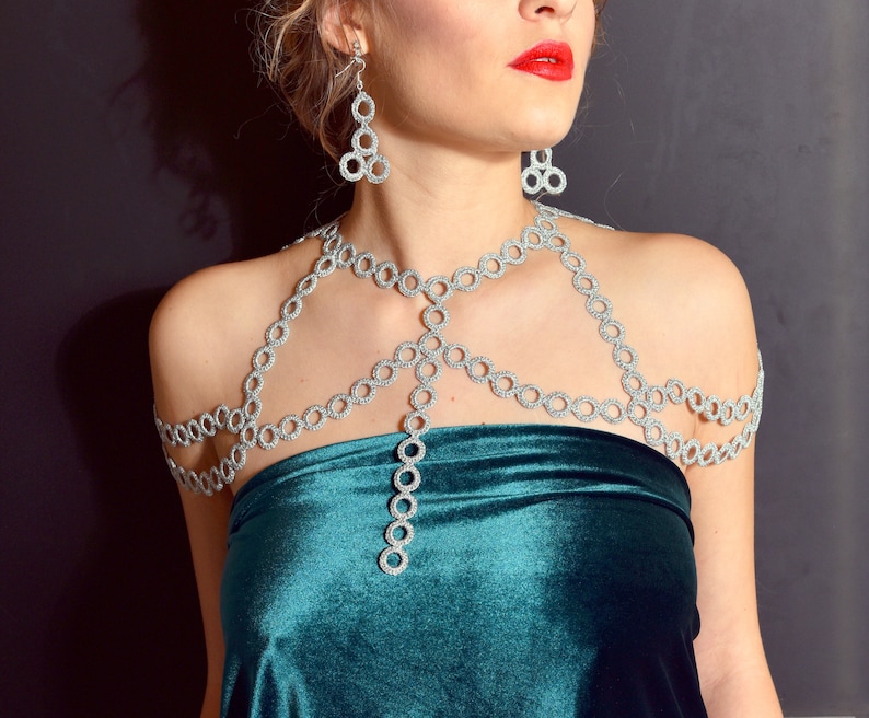 Silver color shoulder jewelry and earrings are great festive outfit for ladies