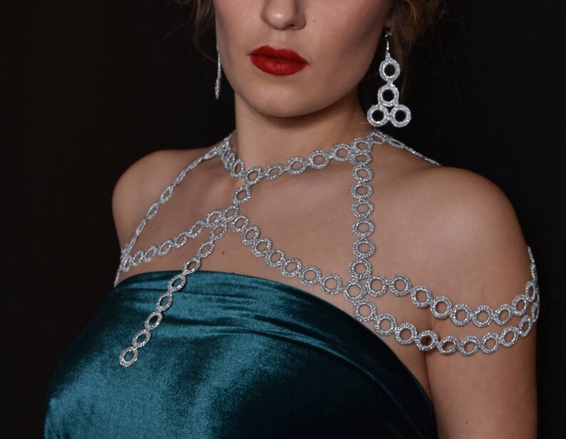 Silver color shoulder jewelry and earrings are great festive outfit for ladies