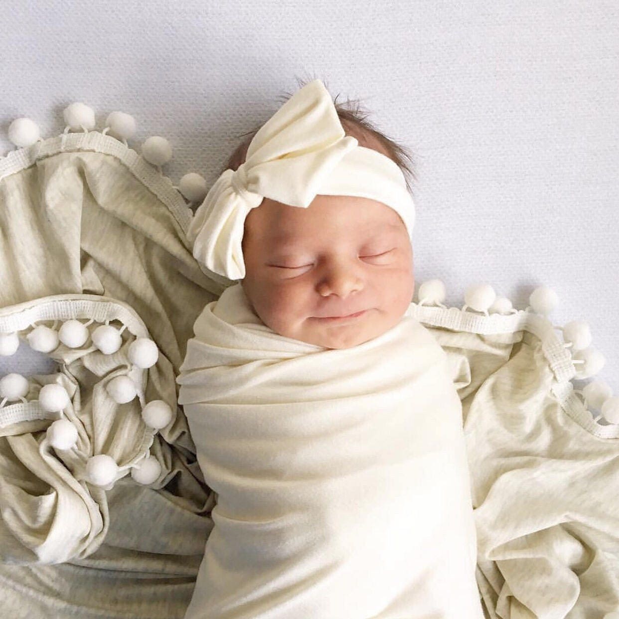 pom pom swaddle blanket