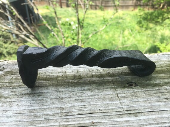 Items similar to Hand forged railroad spike bottle opener. on Etsy