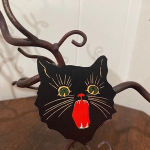 Tête de chat de style vintage jusqu'à 30 cm (12 po.) avec des crocs et des yeux jaunes et verts, décoration d'Halloween en papier cartonné découpé à la main, encadrement, décoration de cupcakes