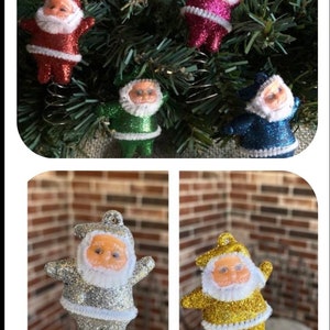 May include: Five vintage Christmas tree toppers featuring Santa Claus in different colors. The toppers are made of plastic and have a spring base. The colors are red, green, blue, silver, and gold.