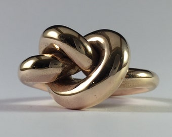 Ring, knot, sculpture, in polished bronze