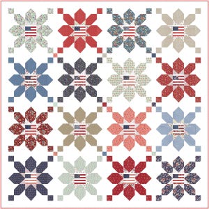 May include: A patchwork quilt featuring a repeating floral pattern with an American flag at the center of each flower. The quilt uses red, white, and blue fabrics in various floral and geometric designs. The quilt is on a white background.