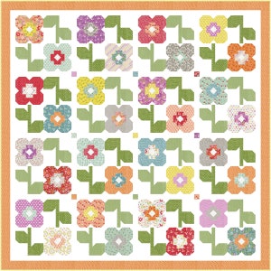 May include: A white quilt with a repeating pattern of green stems and colorful flowers. The flowers are made up of different patterned fabrics and have a simple, geometric shape.
