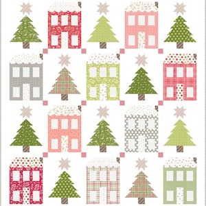 May include: A Christmas quilt pattern featuring a repeating design of houses and Christmas trees. The houses are in various colours and patterns, including red, pink, green, and grey. The trees are all green and have a star on top.