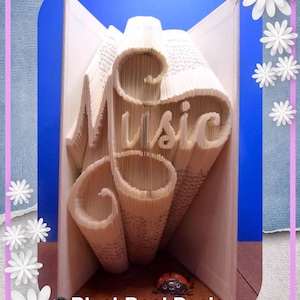 Patrón de plegado de libro de música