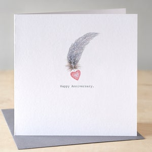 Wedding anniversary card. Anniversary card with feathers and heart. Happy anniversary. Congratulations on your anniversary.